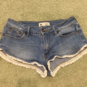 Roxy, mini jean shorts with white ruffles